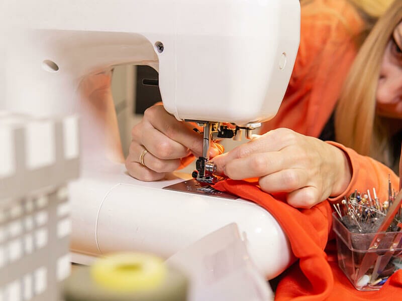 Seamstress Woman Changes Needle